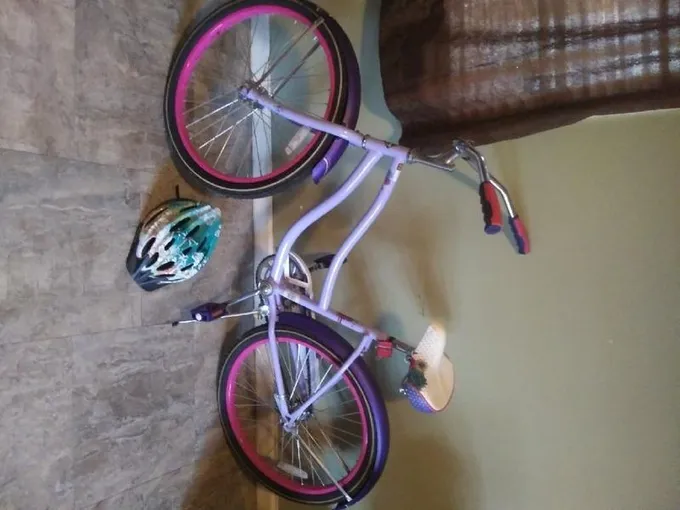 16" huffy bike (lilac) helmet included for Sale